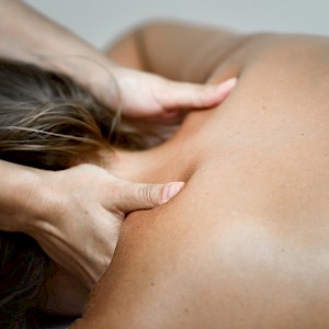 young-woman-receiving-back-massage-spa-center.jpg->first->description
